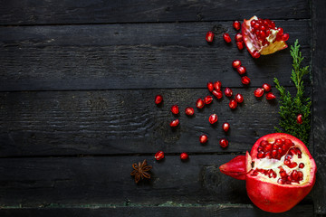 pomegranate red and bright, pieces and grain. Top view. food background