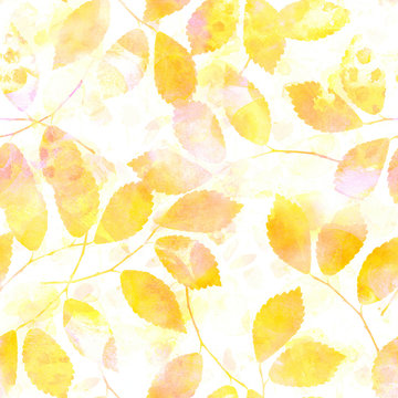 A seamless pattern of yellow autumn leaves with watercolour splashes, a pastel fall repeat print