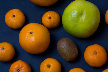 many beautiful bright juicy ripe delicious mouth-watering citrus fruits are are dark blue