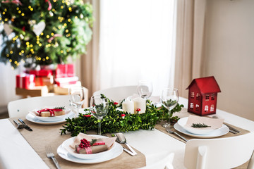 A table set for a dinner at home at Christmas time.