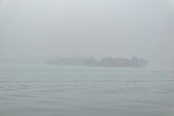 Beautiful Xihu lake(West Lake) with foggy or mist in winter season