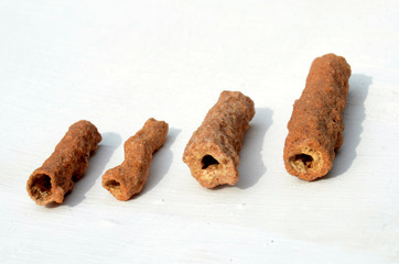 Fossilized lightening; small pieces of sand tubes caused by lightening stoke in a desert. The sand...