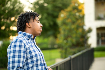 Young African American man in deep thought.