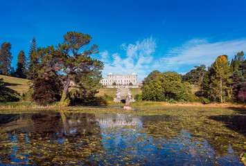 Obraz premium Enniskerry, Ireland, 24th of September 2018. Powerscourt House at Powerscourt Garden. Panoramic view. It's one of leading tourism attractions in Ireland.