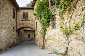 Fototapeta na wymiar Sreet in a small village of medieval origin. Volpaia, Tuscany, Italy.