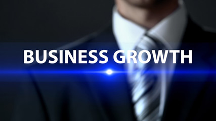Business growth, man in formal suit standing in front of screen business concept