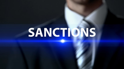 Sanctions, businessman in front of screen, danger prevention, prohibition