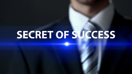 Secret of success, man wearing business suit standing in front of screen, case