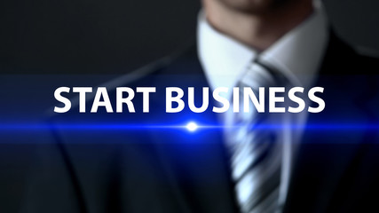 Start business, male in suit standing in front of screen, startup business plan