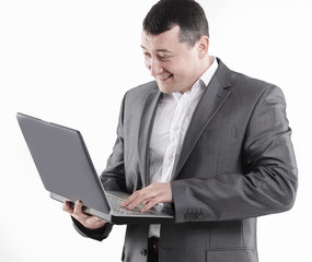 businessman typing on laptop. isolated on white