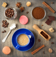 cup of coffee and beans on wooden background