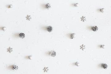 Christmas composition. Christmas silver decorations on white background. Flat lay, top view
