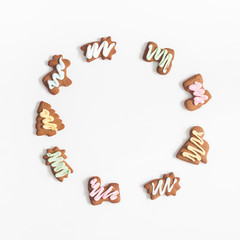 Christmas composition. Christmas gingerbread cookies on white background. Flat lay, top view, square