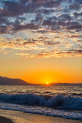 Naklejka premium Early morning , dramatic sunrise over sea and mountain. Photographed in Asprovalta, Greece.