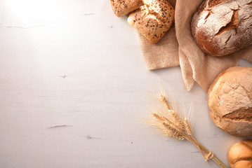 Whole loaf of bread on cutting board traditional vintage