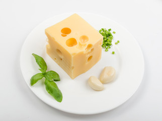 Restaurant Plate of Maasdam Cheese with Greens and Garlic