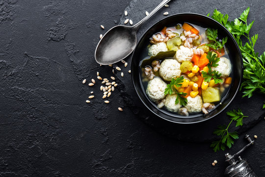 Delicious vegetable soup with chicken meatballs and pearl barley