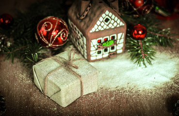 Christmas present on the background of a gingerbread house