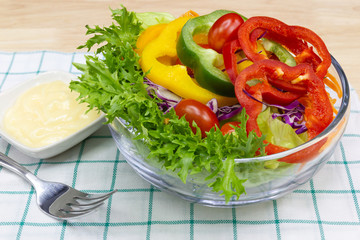 Close up A green salad is a dish consisting of a mixture of small usually vegetables 