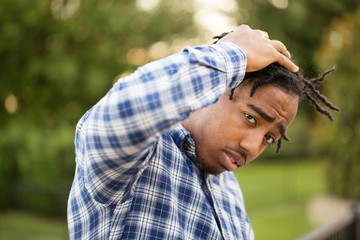 Young African American man in deep thought.