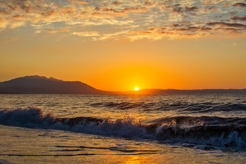 Naklejka premium Early morning , dramatic sunrise over sea and mountain. Photographed in Asprovalta, Greece.