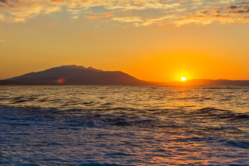 Fototapeta premium Early morning , dramatic sunrise over sea and mountain. Photographed in Asprovalta, Greece.