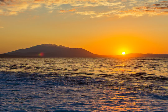 Early morning , dramatic sunrise over sea and mountain. Photographed in Asprovalta, Greece.