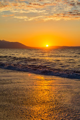 Fototapeta premium Early morning , dramatic sunrise over sea and mountain. Photographed in Asprovalta, Greece.