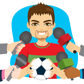 Young Male Soccer Football Player Holding Ball And Hands Holding Microphones On Interview