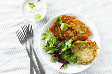 Vegetarian snacks appetizers courgettes fritters healthy breakfast white background top view