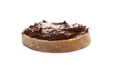 Cream chocolate with hazelnut chunks on slice of bread isolated on white background