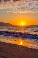 Fototapeta premium Early morning , dramatic sunrise over sea and mountain. Photographed in Asprovalta, Greece.
