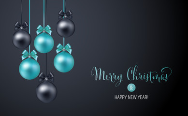 Christmas background with blue and black evening baubles