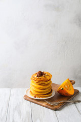 Stack of pancakes with pecan and syrup