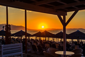 View of the sunrise through a local restaurant