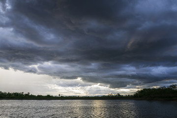 Light in the Dark and Dramatic Storm Clouds background