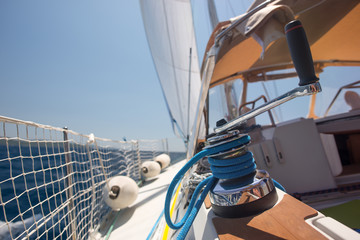 Winch with rope on a sail boat in the sea