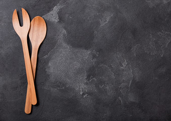 Vintage kitchen wooden utensils on stone table background. Top view. Space for text