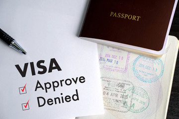 Visa and passport to approved stamped on a document top view in Immigration Visa approve