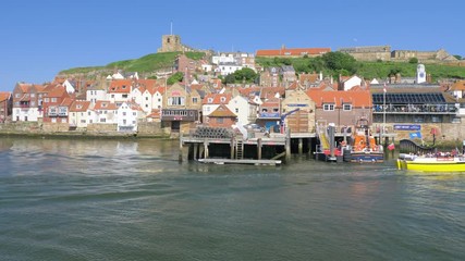 The RNLI Lifeboat station within Whitby harbour on a beautiful evening.