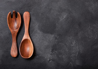 Vintage kitchen wooden utensils on stone table background. Top view. Space for text