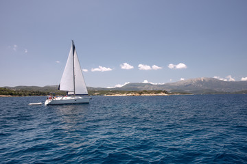 Fototapeta na wymiar Sail boats sailing in the mediterranean sea