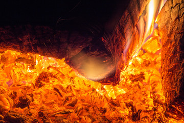 Red hot coals burning in the fireplace, close-up