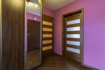 Purple hall interior in the apartment