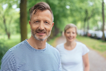 Obraz premium Portrait of a handsome middle-aged man smiling