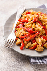 Pasta with chicken and pepper in tomato sauce