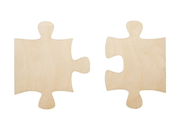 Fototapeta premium two wooden puzzles isolated on white background
