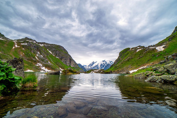 Obraz premium Swiss alps water reflection in Lac de Louvie - mountain lake above Val de Bagnes valley, Switzerland.