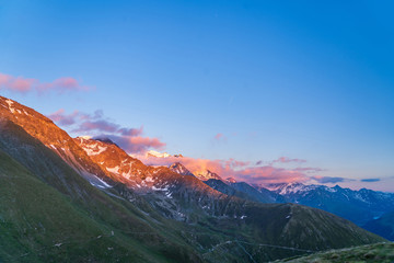 Obraz premium Scenic view of beautiful landscape of Swiss Alps in a Val De Bagnes area. Dramatic sunset scene in high mountains.
