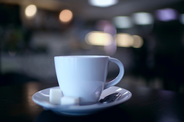 Fototapeta premium cup of coffee for breakfast in a cafe / serving cup of coffee in modern interior, a European breakfast